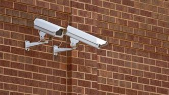 CCTV Cameras installed on a red brick wall