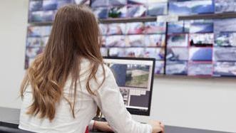 A person Monitoring CCTV