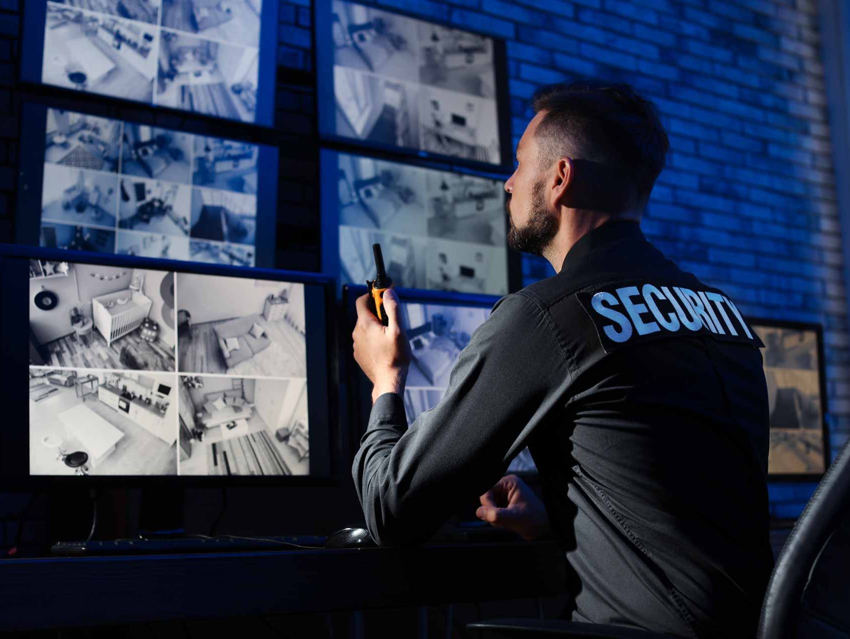 A security guard doing remote CCTV monitoring